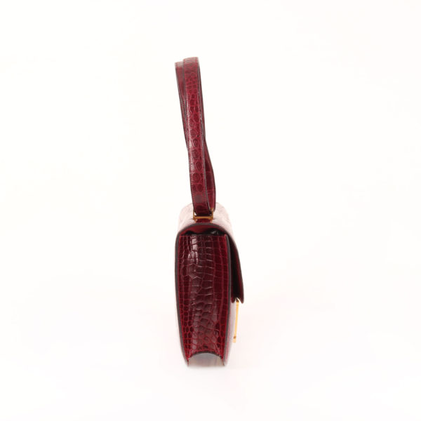 Imagen del lado 2 del bolso hermès constance en cocodrilo porosus raspberry
