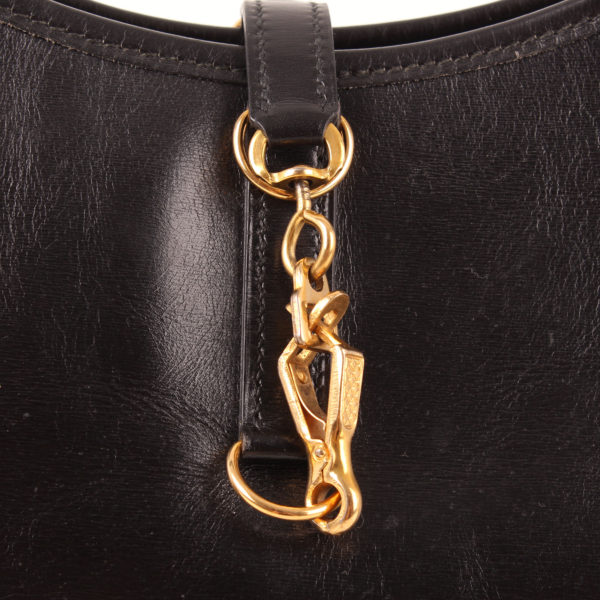 Imagen del cierre del bolso hermès trim 2 herrajes oro negro