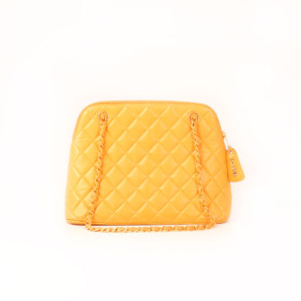 Front image of chanel straw quilted bag